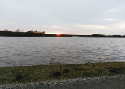 Sun setting over canal.